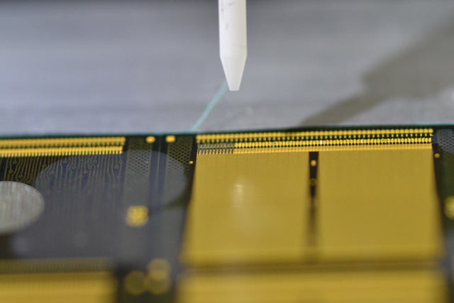 Fig. 1:Printed 35-micron wires/interconnects for stacked die in advanced semiconductor packaging applications. Source:Optomec